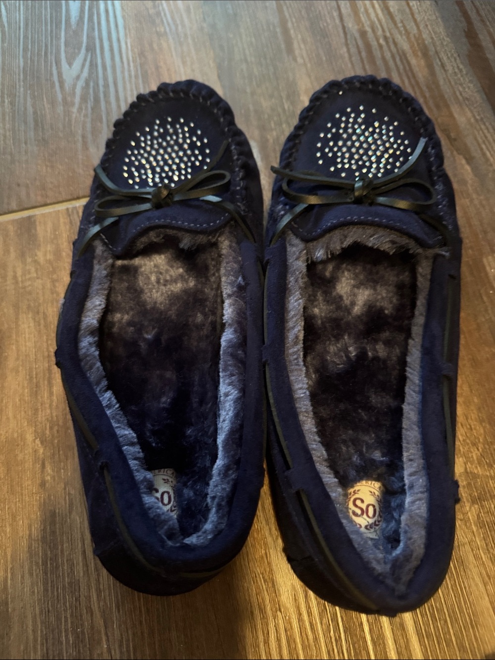 SO Navy Faux-Fur Lined Moccasins with Bow and Stud Accents